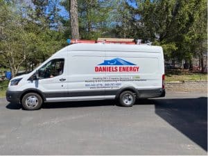 A white van with the words daniel's energy on it, driven by The Magic Man.