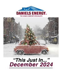 A red car with a Christmas tree on top drives through a snowy street. Text reads: "Daniels Energy. Just In... December 2024.