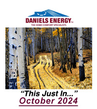 An image reveals a serene autumn forest trail framed by birch trees. Bold text elegantly states, "This Just In... October 2024," accompanied by the Daniels Energy logo.